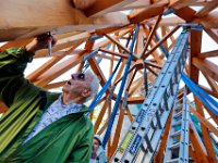 1010073504 ma nb GraceChurchSteeple  Retired longtime pastor of the Grace Episcopal Church in New Bedford signs the beams of the new steeple before it is hoisted to the top of the church.   PETER PEREIRA/THE STANDARD-TIMES/SCMG : church, steeple, high, work, labor